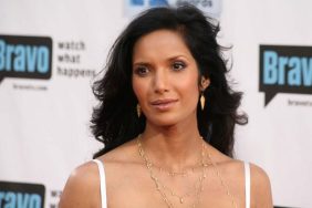 Padma Lakshmi white spaghetti strap dress, gold earrings, gold layered necklace